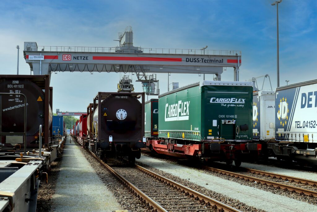 A freight train with CargoFlex trailers at a terminal